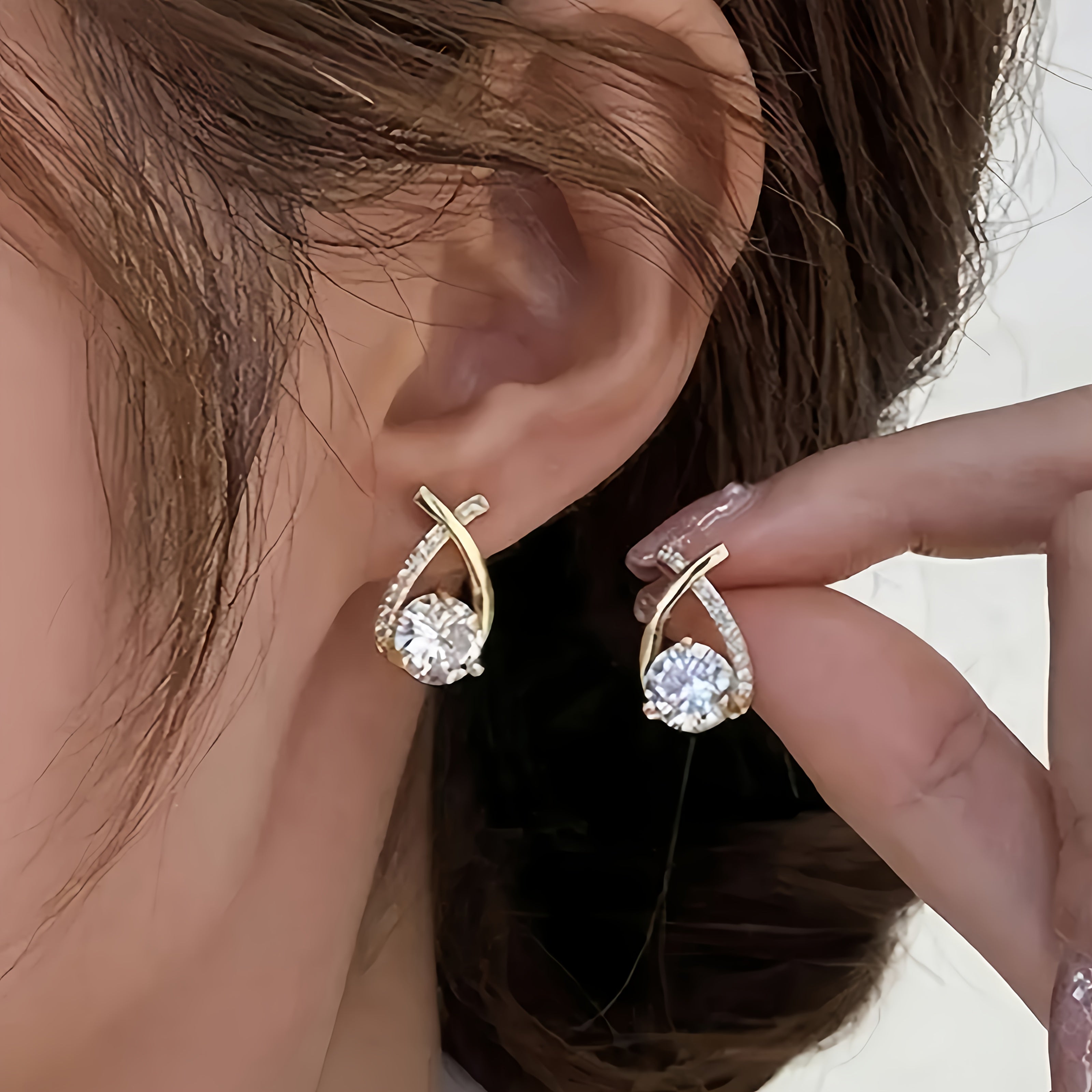 Stud earrings with golden cross and zirconia