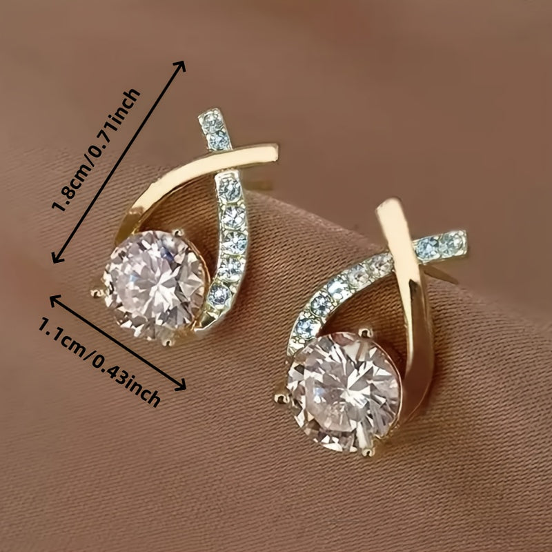 Stud earrings with golden cross and zirconia